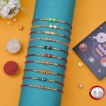 TECHBASICS Combo of 10 Dora Rakhi Set for Brother, Bhaiya, Bhabhi for Rakhi/Rakshabandhan with Roli Chawal & Greeting Card | Premium Rakhi Hamper RKHMPR52