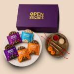 Open Secret Rakhi Set for Brother | Combo of 8 | Rakhi Gift for Brother & Bhabhi, Gift Hamper, Rakshabandhan Gifts for Sister, Assorted Cookies with Rakhis & Roli Chawal Tilak Set