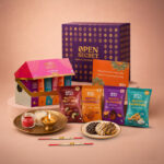 OPEN SECRET Rakhi Gift Hamper for Brother | 12 Cookies, 4 Flavoured Nuts, 2 Rakhis & Card Assorted Gift Box(Purple)
